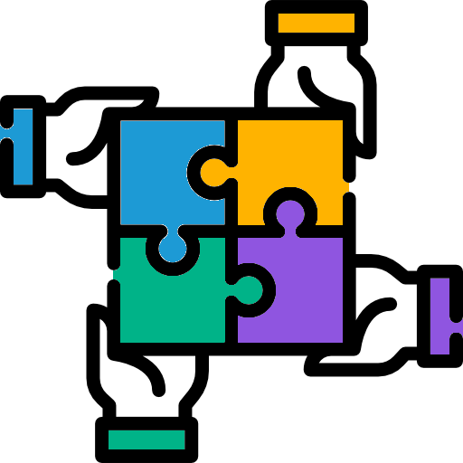 Four hands, each emerging from a different corner of the frame, hold colorful puzzle pieces that match their shirt cuffs. The pieces join together in the center to form a complete square, symbolizing networking, teamwork, and collaboration.